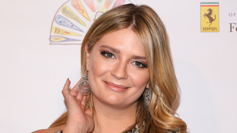 Mischa Barton poses with hand on neck